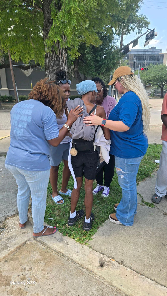 Disciples Global Outreach team praying with a neighbor in Houston