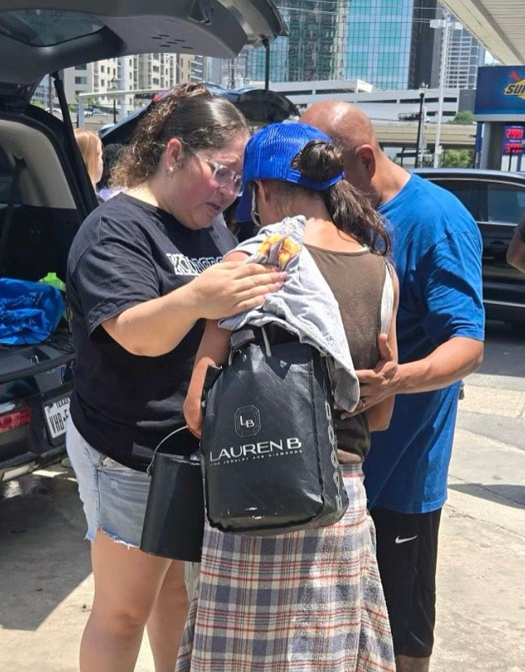 Disciples Global Outreach team praying with a neighbor in Houston